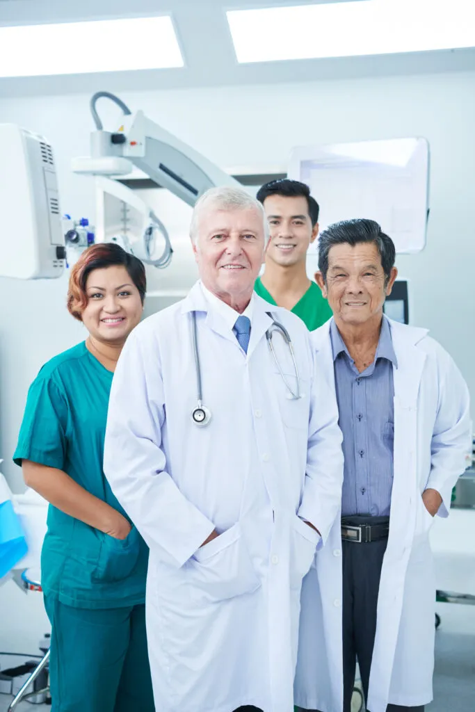 Dental practice team standing together in a clinic